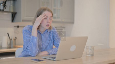 Photo for Young Woman Shocked by Loss on Laptop - Royalty Free Image
