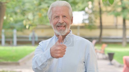 Photo for Outdoor Portrait of Senior Old Man Doing Thumbs Up - Royalty Free Image