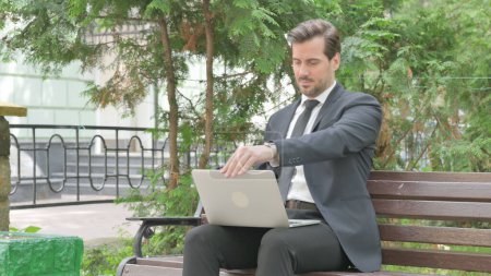 Photo for Middle Aged Businessman Coming, Sitting on Bench and Working on Laptop - Royalty Free Image