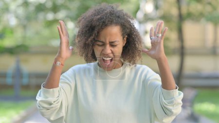 Photo for Angry Young African Woman Arguing and Screaming Outdoor - Royalty Free Image