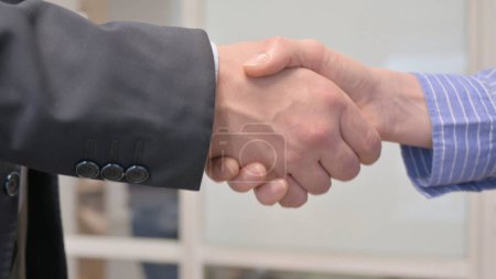 Photo for Handshake by Business People in Office - Royalty Free Image