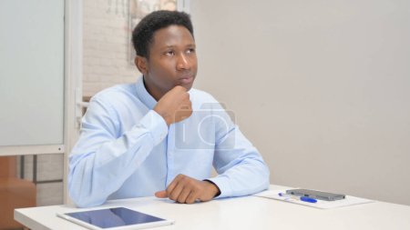 Photo for Pensive African Businessman Sitting in Office - Royalty Free Image