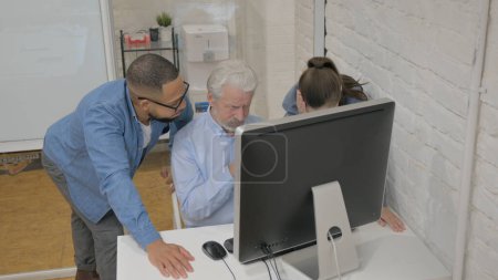 Photo for Multiracial People Reacting to Loss on Computer in Office - Royalty Free Image