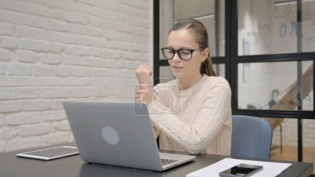 Photo for Creative Woman having Wrist Pain at Work - Royalty Free Image