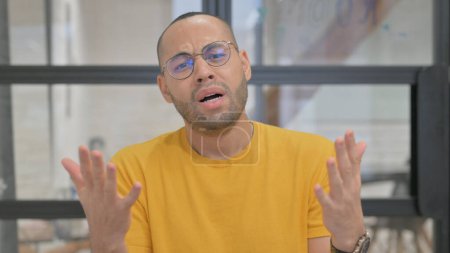 Photo for Portrait of Mixed Race Man Reacting to Failure - Royalty Free Image
