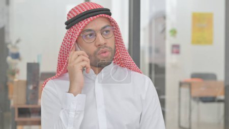 Photo for Portrait of Young Arab Man Talking on phone - Royalty Free Image