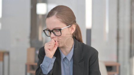 Photo for Portrait of Coughing Sick Young Businesswoman in Office - Royalty Free Image