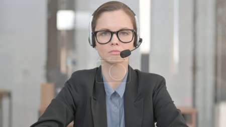 Photo for Young Woman with Headset in Call Center - Royalty Free Image