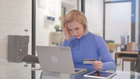 Photo for Young Woman Upset with Online Shopping Failure on Laptop - Royalty Free Image