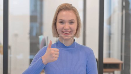 Photo for Portrait of Young Woman with Thumbs Up - Royalty Free Image