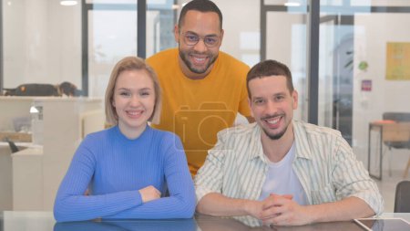 Photo for Portrait of Smiling Mixed Race Teammates in Office - Royalty Free Image