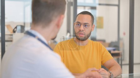 Photo for Patient Discussing Health Issues with Doctor - Royalty Free Image