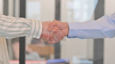 Photo for Close up of Shaking Hands in Office - Royalty Free Image