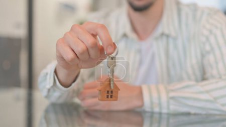Photo for Close up of Hand Offering Home Keys - Royalty Free Image