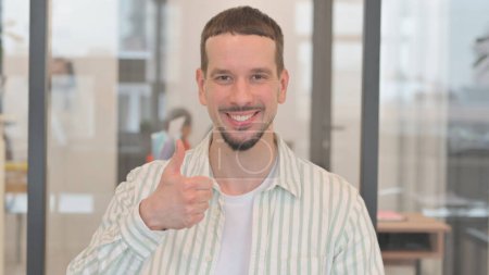 Photo for Portrait of Creative Young Man with Thumbs Up - Royalty Free Image
