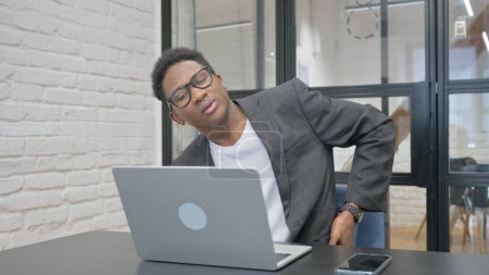 Photo for Young African Man having Back Fatigue and Pain in Office - Royalty Free Image