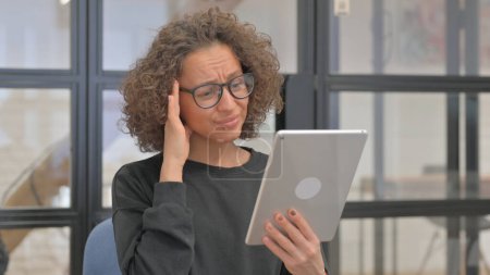 Photo for Portrait of Shocked Mixed Race Woman Using Tablet - Royalty Free Image