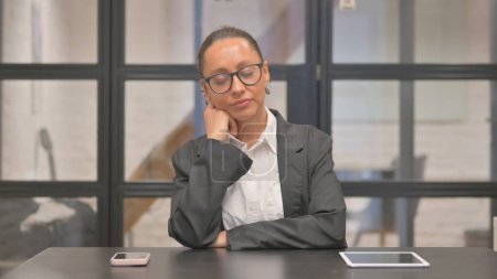 Photo for Mixed Race Business Woman Sleeping in Office - Royalty Free Image