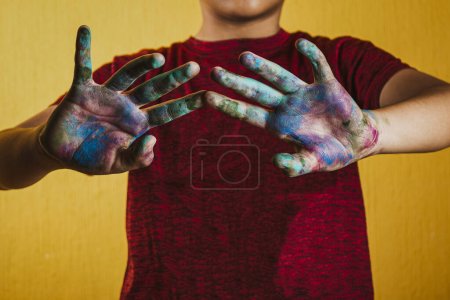 Photo for A man with dirty hands and hands painted - Royalty Free Image