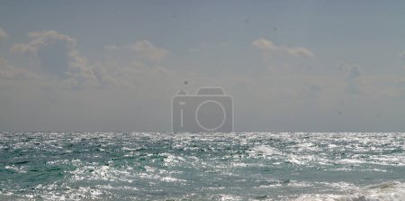 sea horizon on a cloudy windy day for blue natural background,