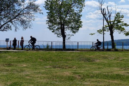 Photo for Varna, Bulgaria - April, 30, 2023: people ride bicycles in a park by the sea - Royalty Free Image