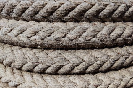 twisted braided rope closeup for natural textile background.