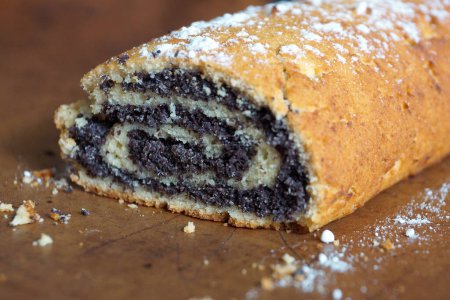 Photo for Sweet curd poppy seed roll in powdered sugar. - Royalty Free Image