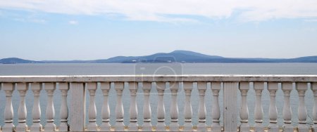sea view behind the stone white railings of the terrace n sunlight