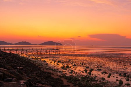 Scene of wooden bridge and beautiful twilight sky at Saphanhin, Phuket, Thailand.