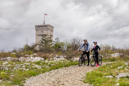 Photo for Active couple on the bikes in beautiful nature in Slovenia - Royalty Free Image