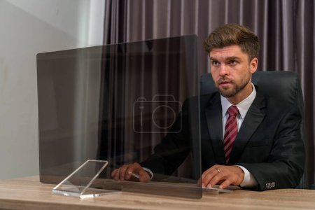Photo for A futuristic businessman looks at an empty transparent monitor screen, ready to add graphics or pictures. This image is perfect for use in presentations, marketing materials, or website designs. - Royalty Free Image