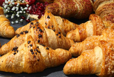 Photo for Pastries and croissants with chocolate chips for a delicious breakfast - Royalty Free Image