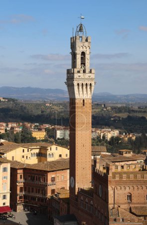 Photo for Famous Bell Tower called TORRE DEL MANGIA in Siena City in Italy - Royalty Free Image