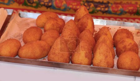Arancini are a typical food from Southern Italy made with fried rice meatballs