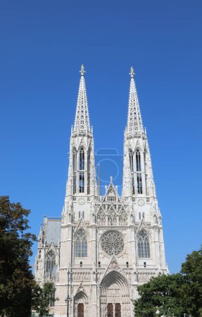 Photo for Two very high bell towers of the VOTIVE CHURCH called Votivkirche in Vienna in Austria in central europe - Royalty Free Image