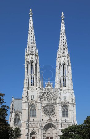 Photo for Two high bell towers of the VOTIVE CHURCH in Wien in Austria In Central Europe - Royalty Free Image
