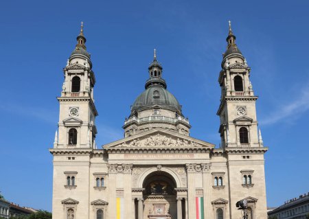 Photo for Two bell towers and dome of St. Stephen s Basilica in BUDAPEST in HUNGARY in Europe with flags - Royalty Free Image