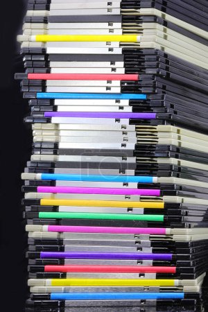 Photo for Tall pile of old floppy disks where data was saved during the 1990s and 2000s in computers - Royalty Free Image