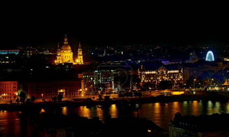 Photo for Night view of St Stephens Church in Budapest capital of Hungary and the reflections on the Danube River - Royalty Free Image