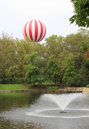 Photo for Hot-air balloon in the public park with little lake without people - Royalty Free Image
