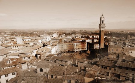 Photo for Civic tower called Torre del Mangia and panorama of the city of Siena in Tuscany in Central Italy with sepia Toned - Royalty Free Image