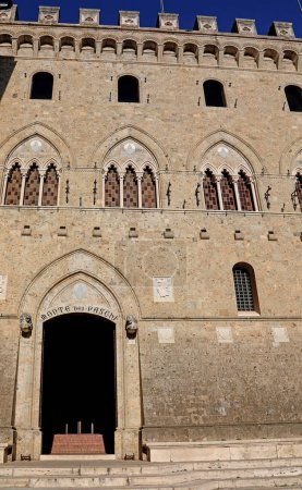 Photo for Siena, SI, Italy - February 20, 2023: Entry to Monte dei Paschi  Bank s Grand Historical Headquarters Building in the Heart of the city - Royalty Free Image
