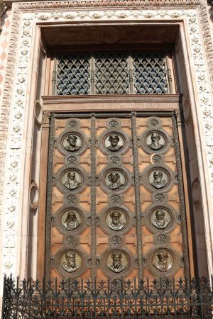 Photo for Budapest, B, Hungary - August 19, 2023: wooden gate with faces at St Stephen s Basilica in Budapest  Hungary - Royalty Free Image
