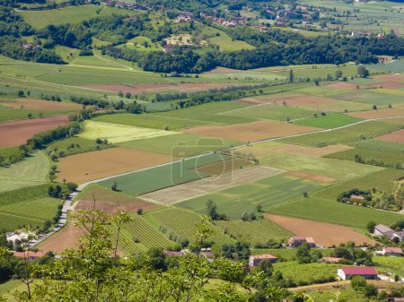 panorama seen from above of the plain with the cultivated fields divided into geometric shapes