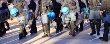 Photo for Vicenza, VI, Italy - January 20, 2024: Italian police in riot gear during the protest demonstration with helmets and shields - Royalty Free Image