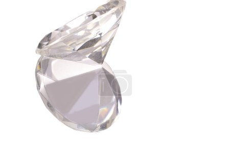 Photo for Large brilliant cut diamond on a white background with a mirrored reflection underneath - Royalty Free Image
