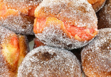 Photo for Many big krapfen with jam alchermes or Alkermes for sale at pastry shop - Royalty Free Image