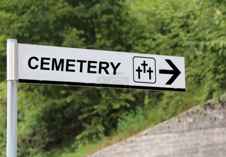 Photo for Large text CEMETERY with the arrow to reach the holy field on the hill - Royalty Free Image