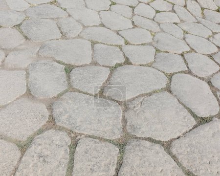 background of stones of an very old ROMAN  road in Italy