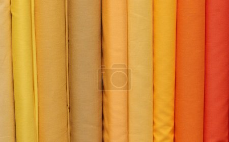 background of colorful fabrics in the fabric and hobby shop